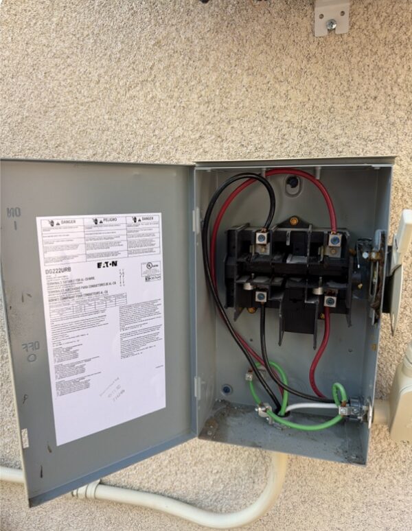 Example AC disconnect with its normal hinged access door open